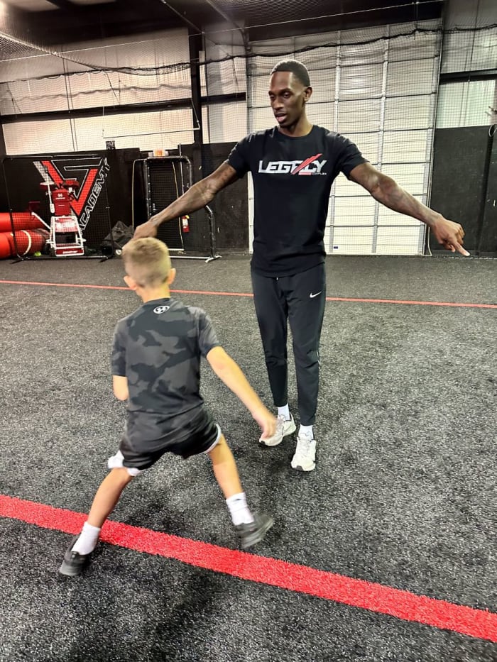 Christian Blake leading drills at Legacy Sports Complex.